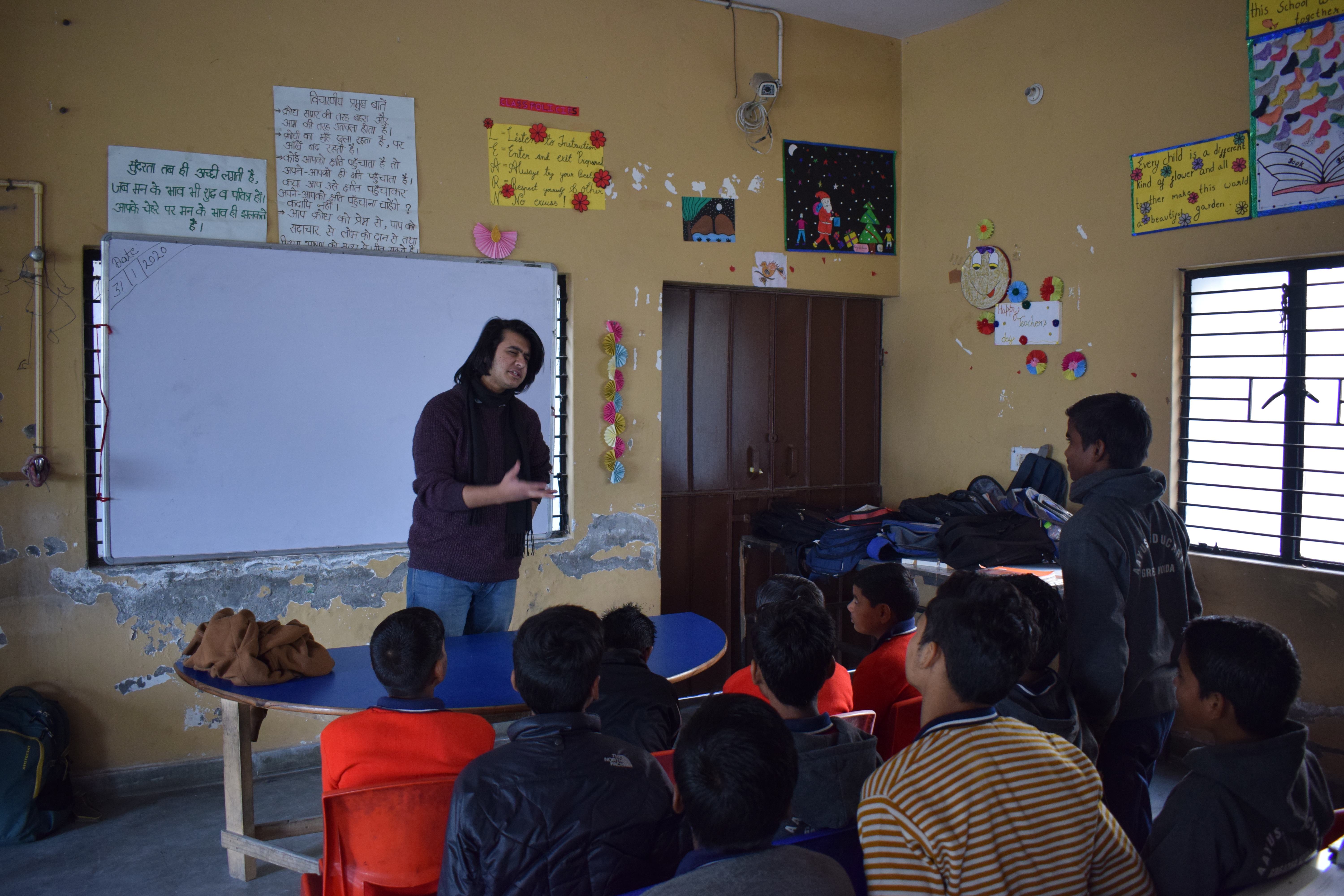 A Pratisandhi facilitator leading a student discussion in a classroom
